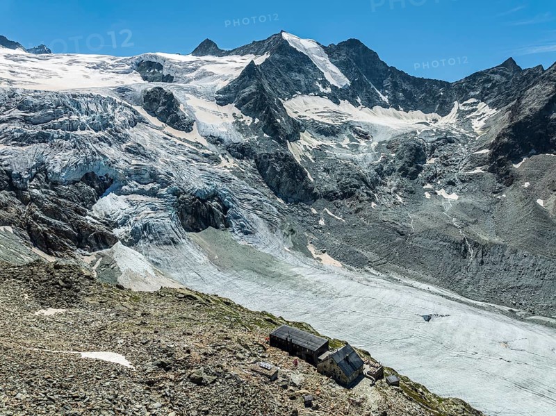 Mountain hut Cabane de Moiry, located close to the retreating Moiry glacier, hiking trail, aerial view, Valais, Switzerland, Europe