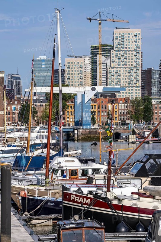 Rotterdam Marina, behind high-rise buildings in the Maritiem District on the other side of the Nieuwe Maas, bascule bridge, pleasure craft harbour, sailing boats, motor yachts, in the inland harbour, Feijenoord district, Rotterdam, Netherlands