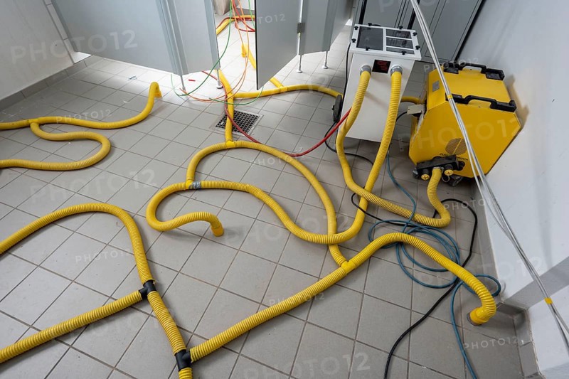 Water damage restoration, dehumidification, after flooding of a building, vacuum drying