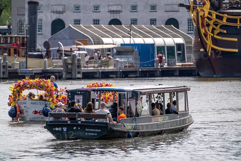 Canal cruise, with Smokeboat.com organiser, smoking is allowed on board, cannabis is not sold, but the cruise starts at a coffeeshop where dope is sold, Amsterdam Netherlands
