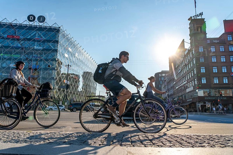 Cyclists on cycle paths, Radhuspladsen, City Hall Square, H.C. Andersen's Boulevard, in the city centre of Copenhagen, considered the cycling capital of the world, 45% of the population travel by bike, Denmark, Europe