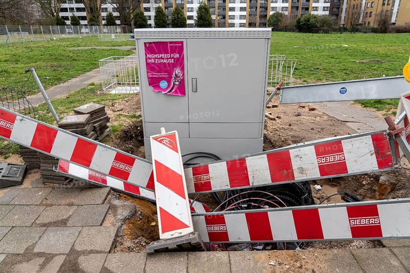 Deutsche Telekom construction site in the Hochheide district of Duisburg, connection of high-speed Internet, fibre optic network, broadband expansion, North Rhine-Westphalia, Germany, Europe
