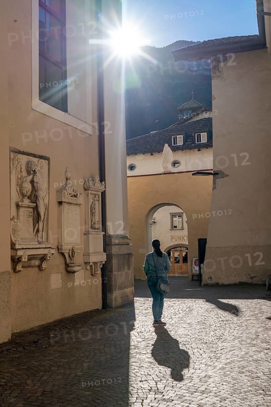 The village of Kaltern, on the South Tyrolean Wine Route, alleyway by the church Parrocchia Maria Assunta Caldaro, Italy, Europe