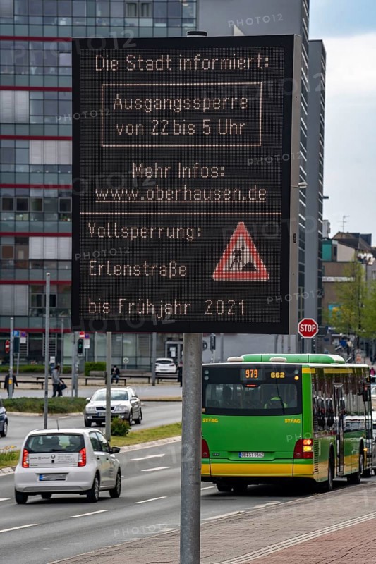 Information on the curfew, during the third Corona lockdown, in Oberhausen, via a large display in the Sterkrade district, North Rhine-Westphalia, Germany, Europe