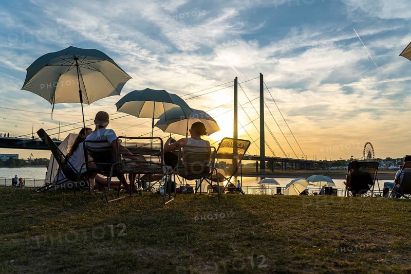 The city beach on the Rhine near Düsseldorf, riverside promenade, by the Rheinkniebrücke bridge, Sunset Chillout, North Rhine-Westphalia
