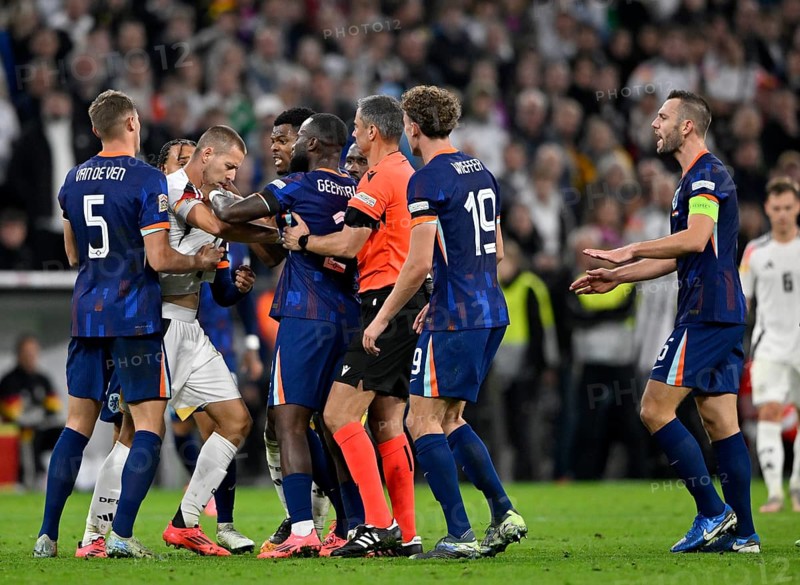 Scuffle around Waldemar Anton GER (03) Denzel Dumfries NED (22) Referee Referee Slavko Vincic (SVN) UEFA Nations League international Germany v Netherlands, Allianz Arena, Munich, Bavaria, Germany, Europe