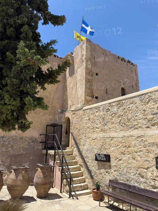 View of the historic monastery defence tower Xopatera tower 19th century tower of Xopatera Xopateras left foreground large clay pots storage containers in the courtyard of Unesco Site Orthodox Greek Orthodox Monastery Moni Odigitria, Festos, Crete, Greece, Europe