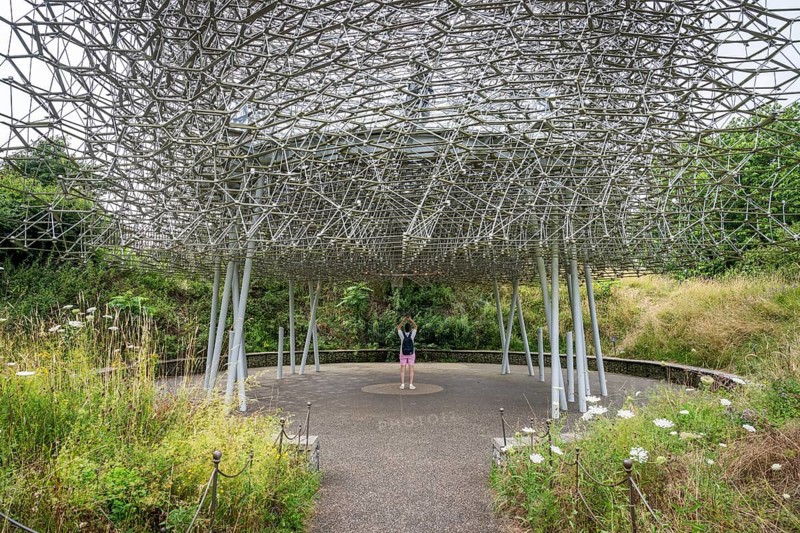 Visitor stands under The Hive, artwork by Wolfgang Buttress, Royal Botanic Gardens (Kew Gardens), UNESCO World Heritage Site, Kew, Greater London, England, United Kingdom, Europe