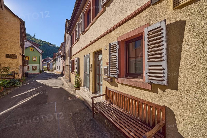 Residential building with shutters and bench in Abteigasse in Amorbach, Lower Franconia, Miltenberg district, Bavaria, Germany, Europe