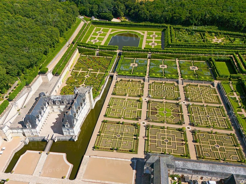 Aerial view of a large castle with symmetrically arranged formal gardens, shaped hedges and water basins, aerial view, Villandry Castle, Renaissance, Tours, Loire Valley, Centre-Val de Loire, France, Europe