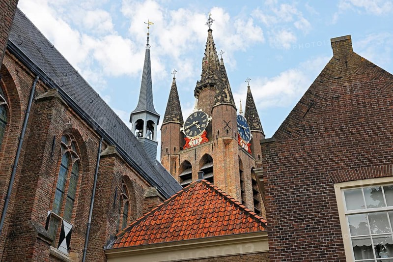 Historic city centre of Delft, Museum Het Prinsenhof in the former Sint Agatha monastery is dominated by the tower of the Gothic Old Church, Oude Kerk, Delft, Zuid-Holland, Netherlands