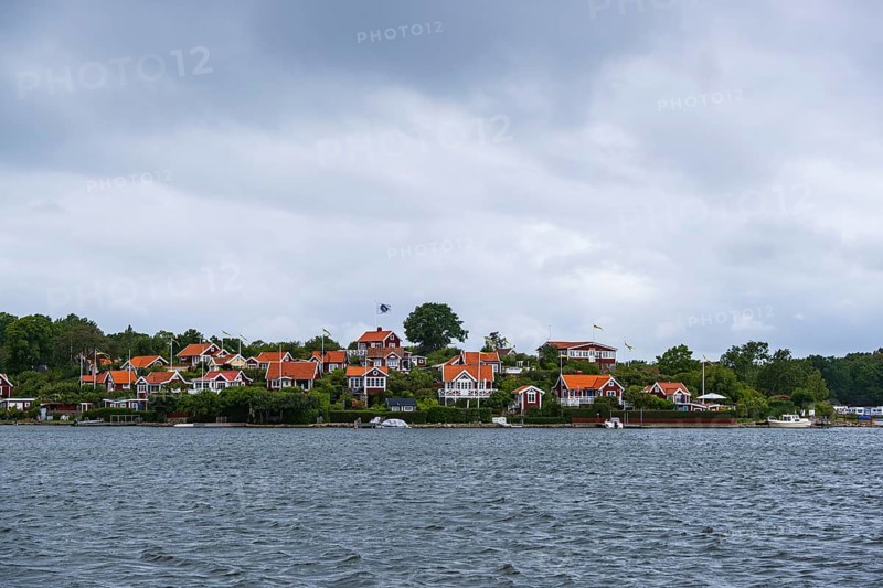 View from the island of Saltö to the famous allotment garden colony Brändaholm on the island of Dragsö in the archipelago of Karlskrona, Blekinge län, Sweden, one of Sweden's most common picture postcard motifs, Europe