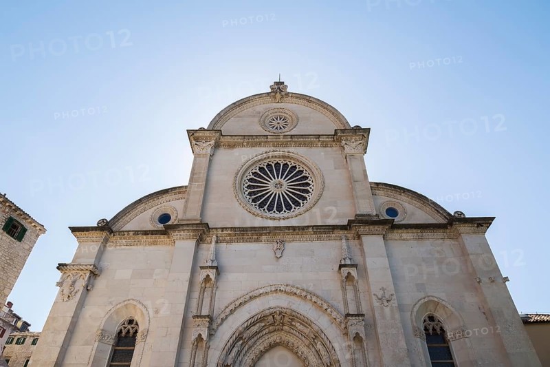 The Cathedral of Saint James facade with carved architectural details and rose window, Sibenik, Croatia, Europe