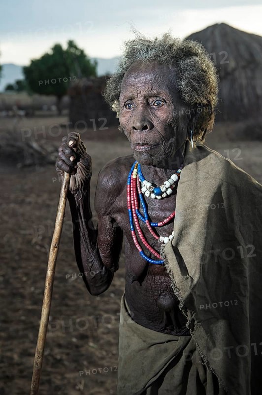 Ethnic group of the Arbore: Old woman adorned with colourful beaded necklaces and metal bracelets, Southern Omo Valley, Ethiopia, Africa