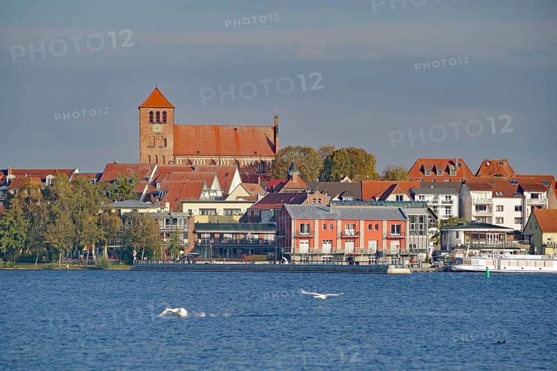 Town view with church and red roofs directly on the water, Tourism, Waren Mecklenburg-Vorpommern, Germany, Europe