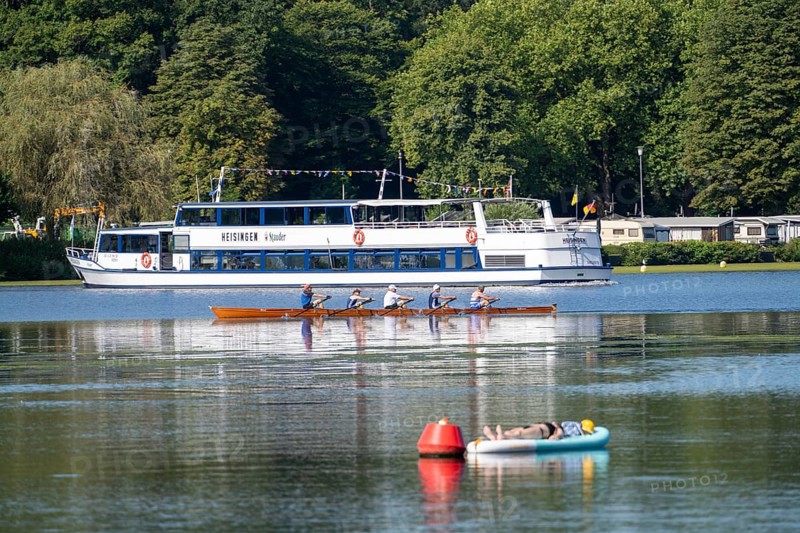 Lake Baldeney, Ruhrstausee, excursion boat of the Weiße Flotte Baldeney, rowing boat, SUP as a reading island, young woman enjoying the summer, reading on her stand-up paddle board, moored to a buoy, Essen, North Rhine-Westphalia, Germany, Europe