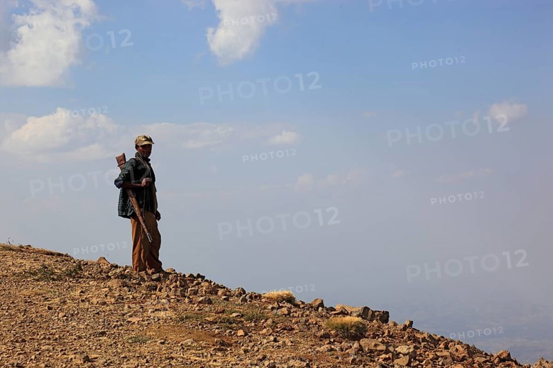In the highlands of Abyssinia, in the Semien Mountains, landscape in the Semien Mountains National Park, guard, accompanying person, Ethiopia, Africa