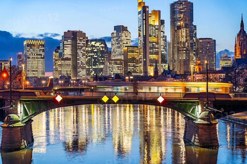 Skyline of the city centre of Frankfurt am Main, river Main, dusk, Ignatz-Bubis-Brücke, tram, Hesse, Germany, Europe
