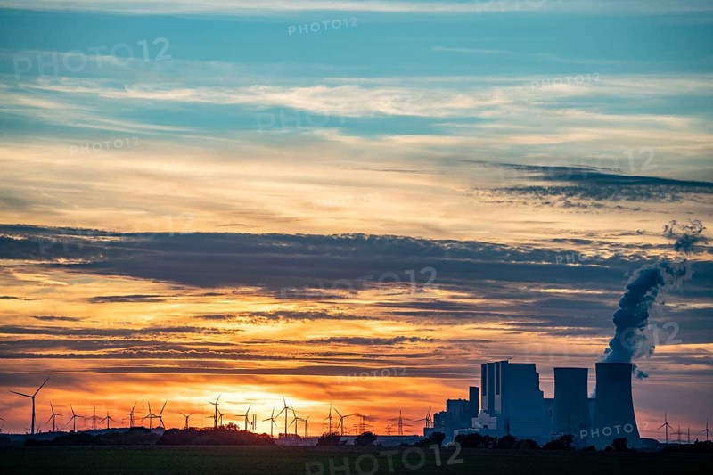 The RWE lignite-fired power plant Neurath, near Grevenbroich, largest German coal-fired power plant, second largest in Europe, Block F-G, wind farm, sunset, North Rhine-Westphalia, Germany, Europe