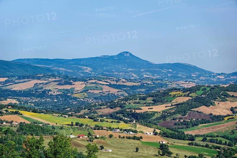 Landscape in the Marche region near San Ginesio and in the background the mountain range of the Marche Apennines