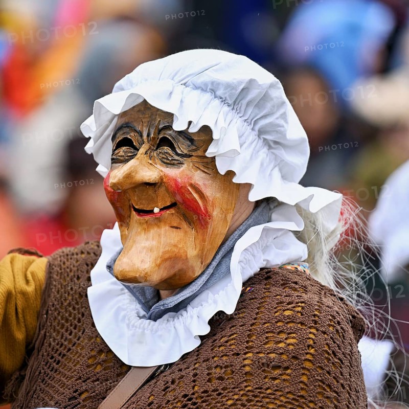 Person masked as a grandmother at the carnival parade of the Wey guild on Rose Monday, Güdismäntig, Lucerne Carnival 2024, Lucerne, Switzerland, Europe