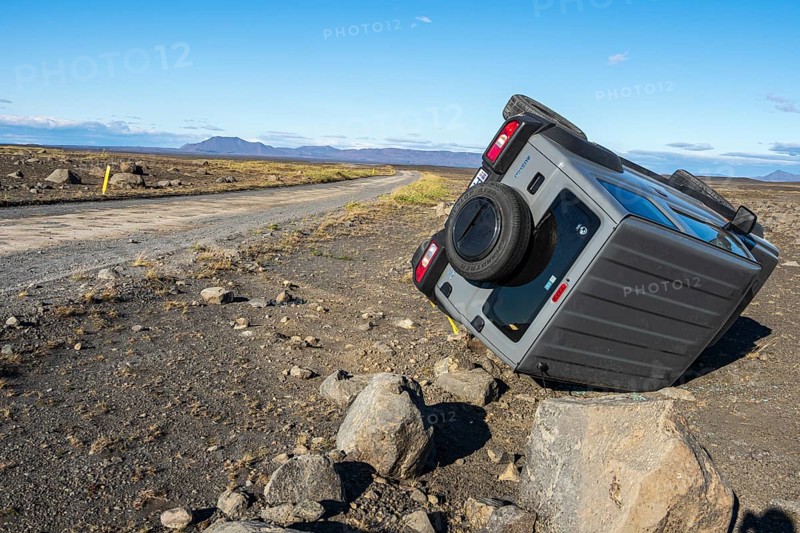 Crashed car, lying on its side, road 864 connecting ring road no.1 with eastern side of Dettifoss waterfall, Iceland, Europe