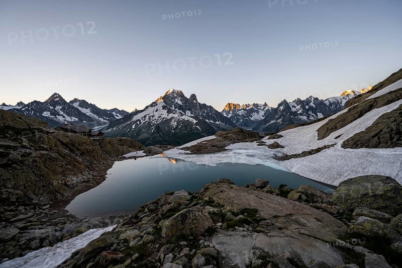 Mountain lake in the morning, mountain landscape at sunrise, water reflection in Lac Blanc, mountain peak, Aiguille Verte, Grandes Jorasses, Aiguille du Moine, Mont Blanc, Mont Blanc massif, Chamonix-Mont-Blanc, Haute-Savoie, France, Europe