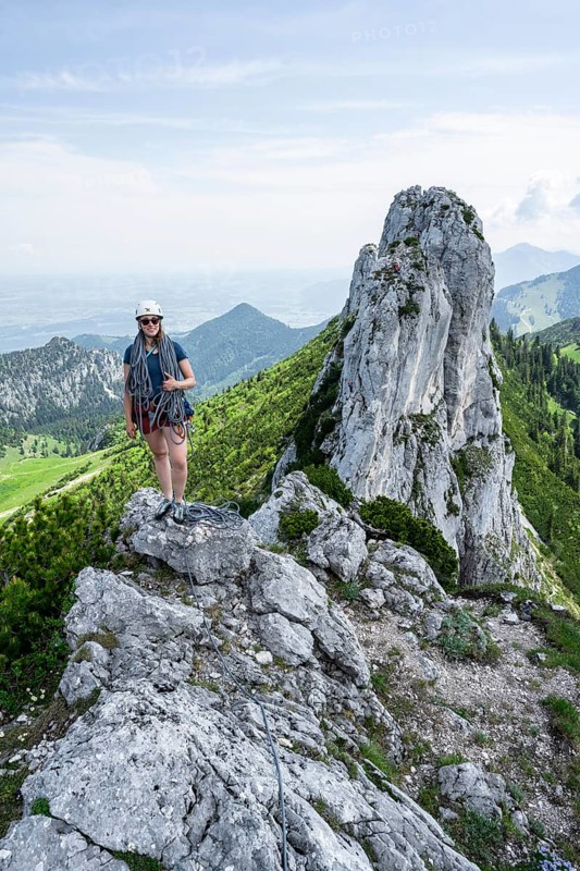 Climber with climbing rope on a climbing tour, climber on a mountain ridge, alpine climbing, crossing the Kampenwand, Chiemgau, Bavaria, Germany, Europe