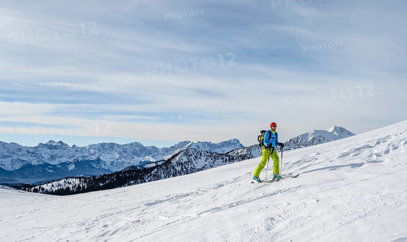 Ski tourers climbing Simetsberg, view of mountain panorama, Estergebirge, Bavarian Prealps, Bavaria Germany