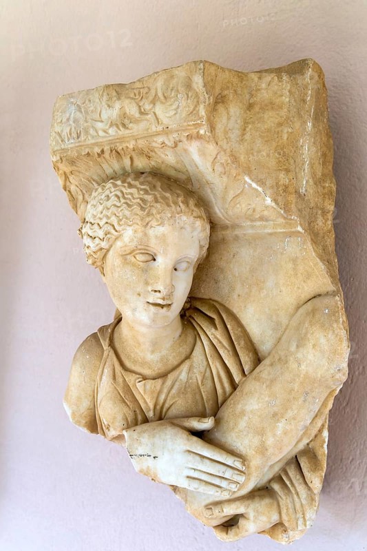 Carved detail of marble sarcophagus figure, Roman archaeology museum, Apollonia Archaeological Park, Albania 2nd century AD
