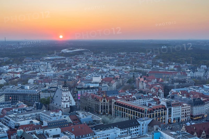 View of the city from the City Tower at sunset, St Thomas' Church, Red Bull Arena and Auwald forest, Leipzig, Saxony, Germany, Europe