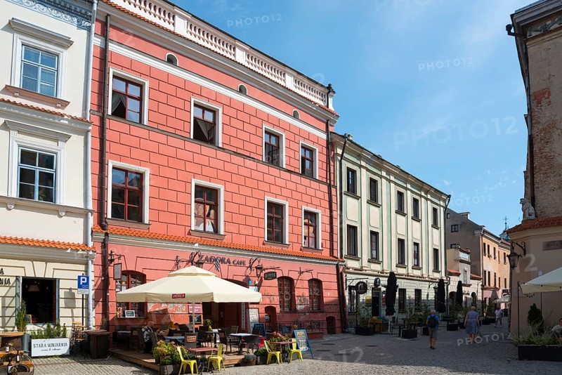 Pink historic building with café and sun terrace in the charming Old Town, Old Town Market Square, Lublin, Poland, Europe