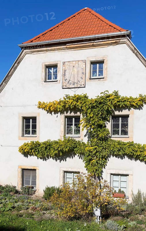 Gable of an old renovated farmhouse with sundial, village centre of Pennrich, Dresden, Saxony, Germany, Europe