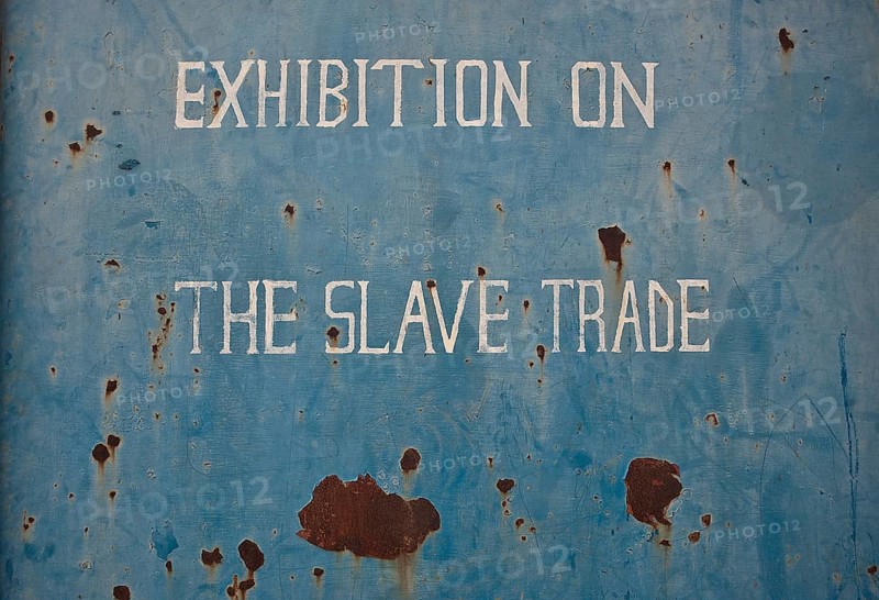 Board indicating Exhibition on the slave trade at the entrance of the slavery museum (Juffureh, Gambia)