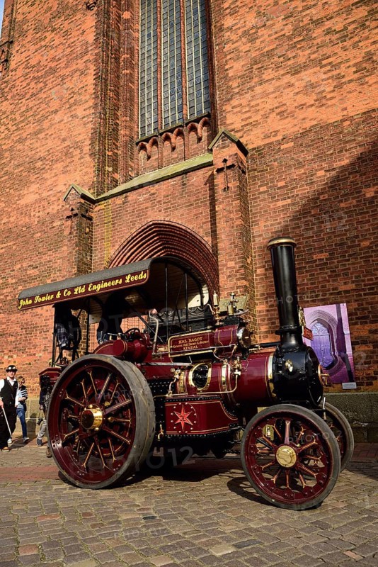 Europe, Germany, Lower Saxony, Hamburg Metropolitan Region, Hanseatic City of Buxtehude, Steampunk Festival, elements of steampunk are steam and cogwheel-driven mechanics, Victorian style of dress, steam locomotive by John Fowler & Co Ltd, Leeds, England, in front of St. Peter's Church, Hamburg, Hamburg, Federal Republic of Germany, Europe
