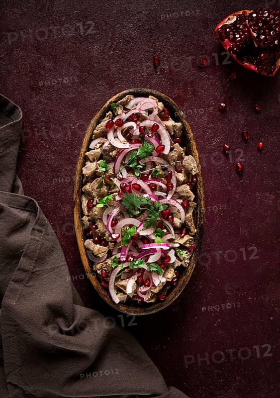 Kuchmachi, Traditional Georgian cuisine, chicken giblets appetizer, with spices and pomegranate seeds, on ketsi, no people, homemade