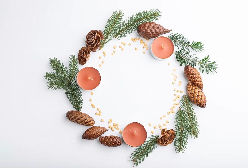 Christmas or New Year wreath composition. Decorations, cones, candles, fir and spruce branches, on white background. Top view, copy space, flat lay