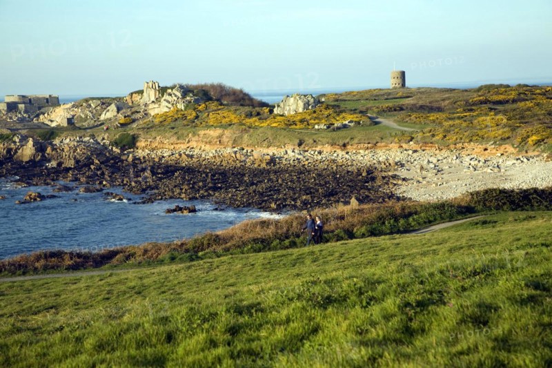 Fort le Marchant headland and loophole 'martello' tower, L'Ancresse bay Guernsey Channel Islands