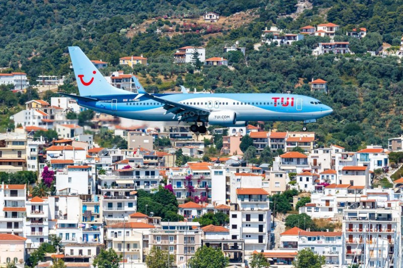 A TUI Airways Boeing 737-800 aircraft with the registration G-TAWO at Skiathos Airport, Greece, Europe