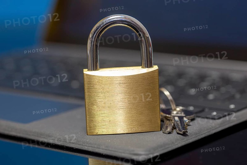 Padlock on a keyboard as a symbolic image for internet security, hacker attacks and so on