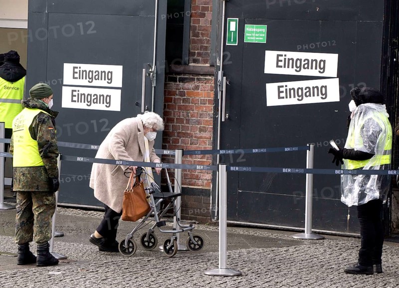 An elderly woman arriving at the vaccination centre in the Arena in Treptow, Berlin, 09.02.2021