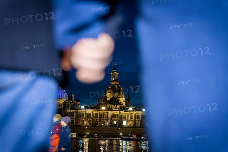 On 13 and 14 February 1945, Dresden was heavily destroyed in three Allied bombing raids. Every year, the people of Dresden commemorate this event at various events. A long human chain symbolised the protection of the city centre. Here looking from the Königsufer across the Elbe to the Old Town, Dresden, Saxony, Germany, Europe