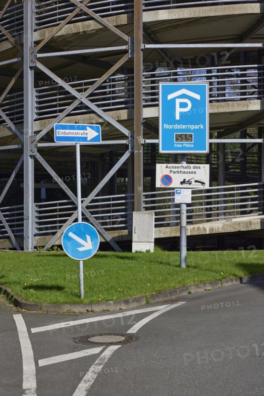 Traffic sign for the multi-storey car park and one-way street sign in Nordsternpark, Gelsenkirchen, Ruhr area, independent city, North Rhine-Westphalia, Germany, Europe