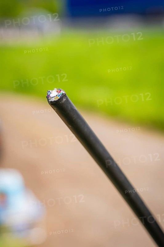 Close-up of a black cable with blurred green background, fibre optic installation, Calw district, Black Forest, Germany, Europe