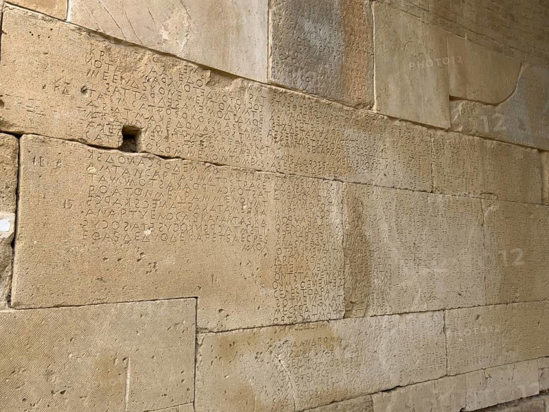 Detailed view of sandstone blocks Stones made of sandstone with written laws carved into the wall of the archway behind the amphitheatre City law of Gortys carved in stone Gortyn law book Large inscription, written in Doric dialect alternately from left to right and right to left, oldest discovered legal text in Europe, Gortyna, Crete, Greece, Europe