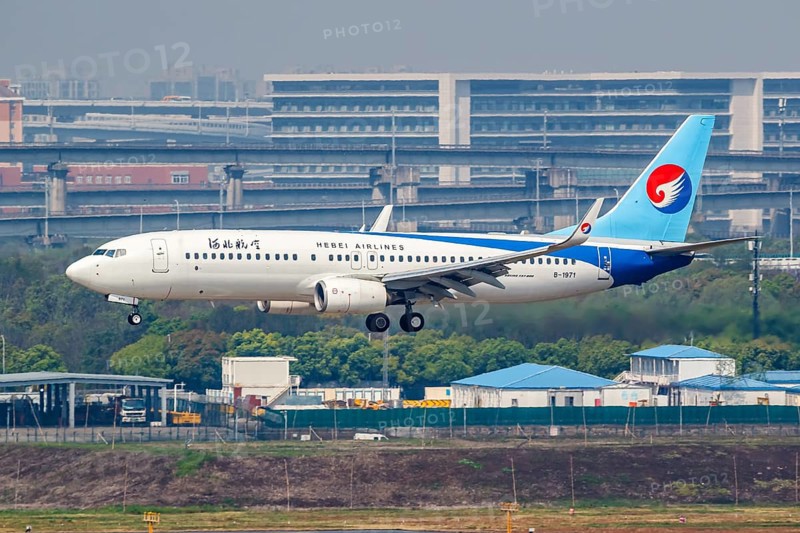 A Boeing 737-800 aircraft of Hebei Airlines with the registration number B-1971 at Hongqiao Airport (SHA) in Shanghai, China, Asia