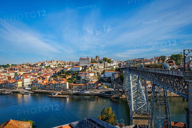 View of Porto city and Douro river and Dom Luis bridge I with metro tram from famous tourist viewpoint Miradouro do Jardim do Morro. Porto, Vila Nova de Gaia, Portugal, Europe