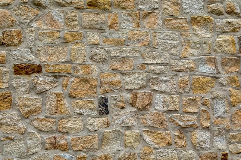 Natural stone wall with a mixture of beige and grey bricks, sandstone wall, background, texture, North Rhine-Westphalia, Germany, Europe