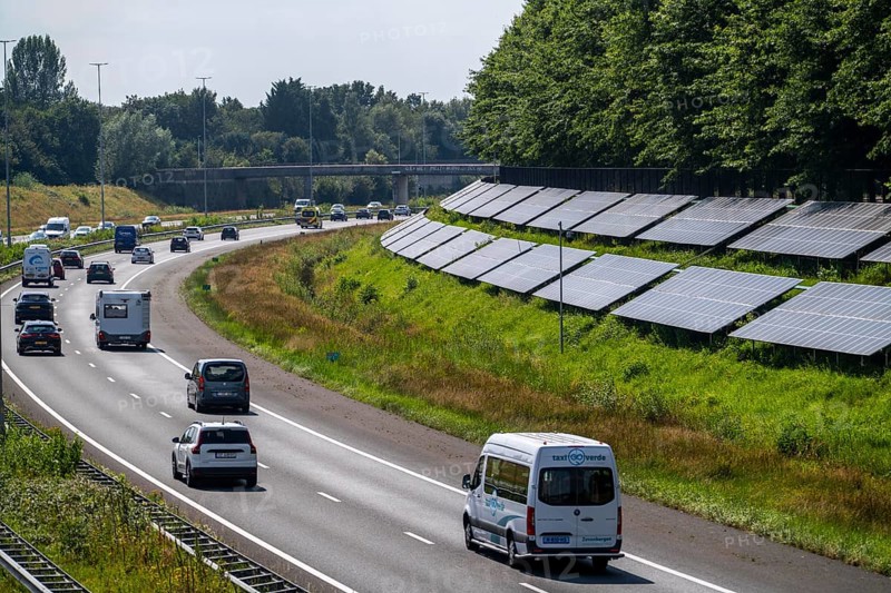 A58 motorway, photovoltaic systems were installed on the slopes to the side of the carriageway, use of the areas along the roads as a solar park, near Etten-Leur, Noord-Brabant, Netherlands