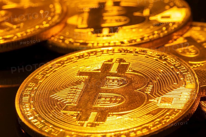 Close-up of symbolic bitcoins